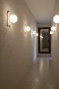 Onsite_Stone_Sconce_Hallway.webp