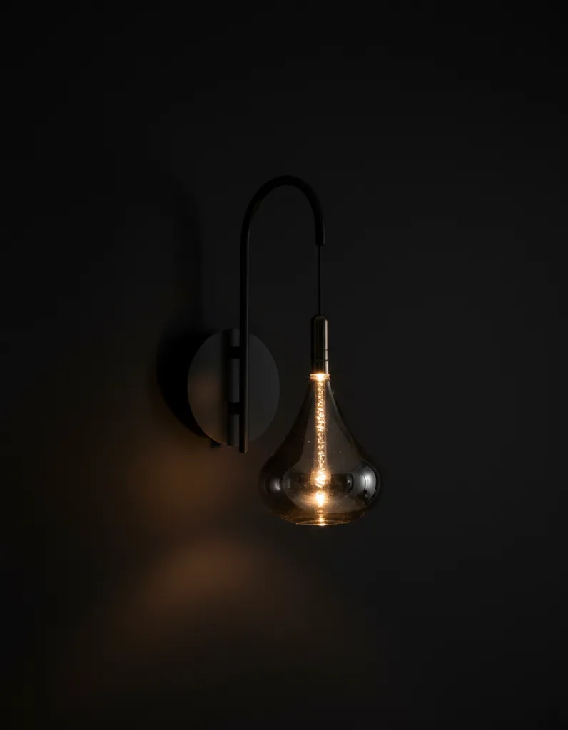 Smoke-Glass-Wall-Light-Illuminated.webp