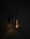 Smoke-Glass-Wall-Light-Illuminated.webp
