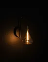 Amber-Glass-Wall-Light-Illuminated.webp